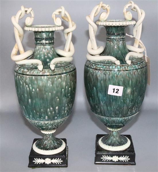 Pair of Wedgwood & Bentley style pottery vases with serpent handles (one restored)